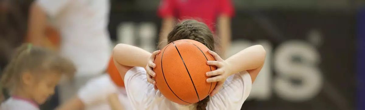 girl passing basketball