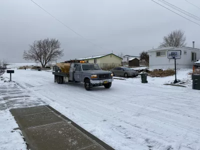 Truck applying gravel