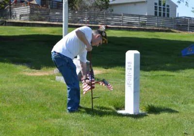 veteran_placing_flag.jpg veteran placing flag