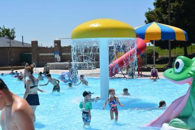 Kids playing under water feature