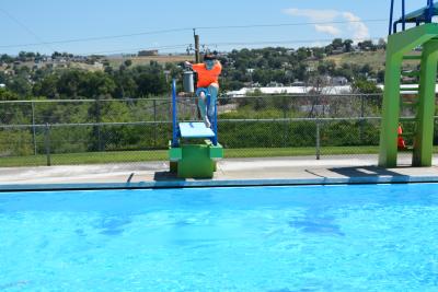 Kid jumping off low dive