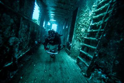 Diver in shipwreck